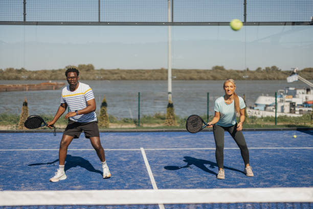 istock Tennis players in synchronized action and laughter 2206075912