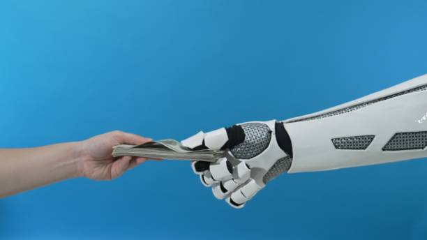 istock Robotic Hand Giving Cash to Human Hand on Blue Background 2206076199