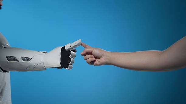 istock Human Touch Meets Robotic Arm in a Future Technology Scene 2206076679