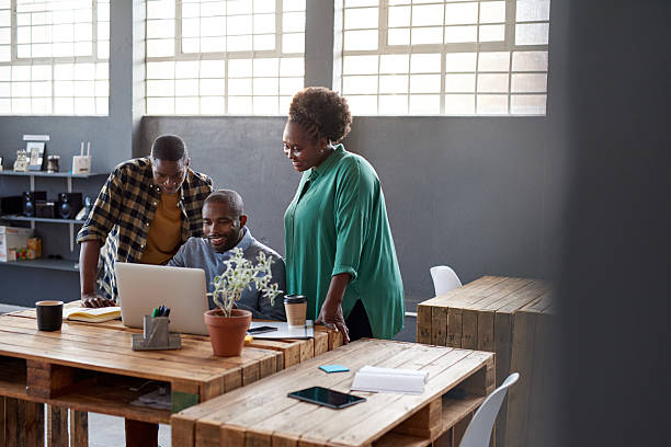 istock African businesspeople using a laptop together in a modern office 2206079945