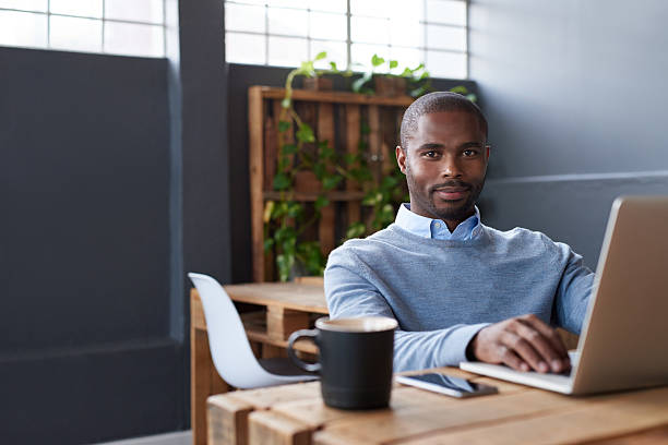 istock Young African businessman working on a laptop in an office 2206080053