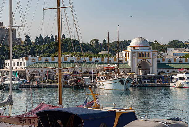 Rhodes City, Rhodes, Greece - October 19, 2024: A picture of the Nea Agora as seen from across the Mandraki Marina.