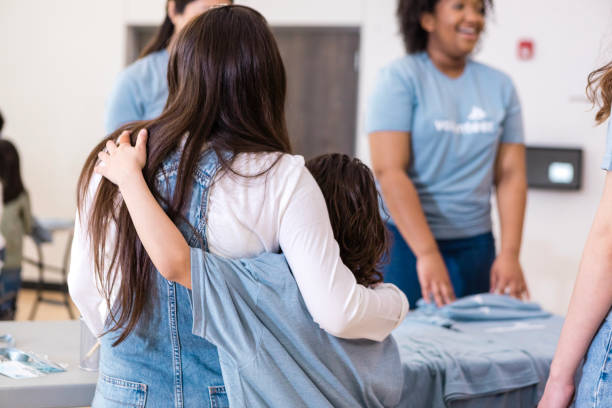 istock Multiracial women hugging, showing togetherness and support 2206080962