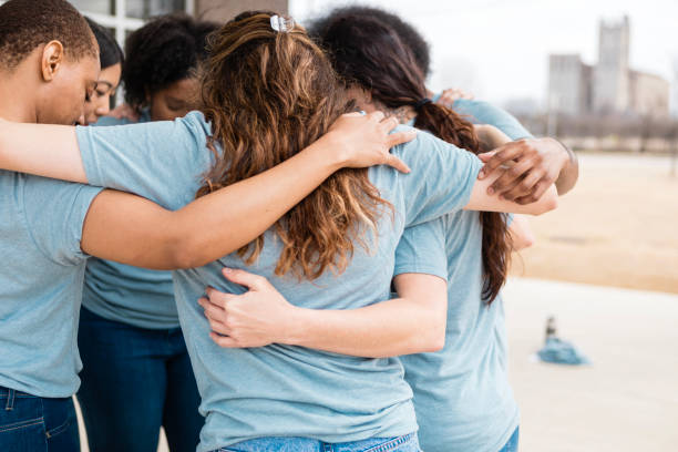 istock Diverse Women Embracing in Circle Showing Unity and Support 2206081033