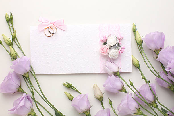 istock Romantic Wedding Invitation Flat Lay  Pink Envelope, Blank Card, Wedding Rings, and Elegant Decorations 2206082708