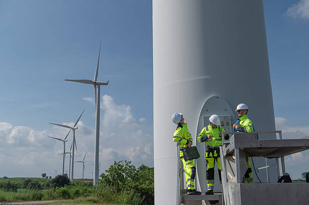 istock Wind Turbine Maintenance and Repair Technician, Engineer team professional working maintenance clean power generator system 2206084017