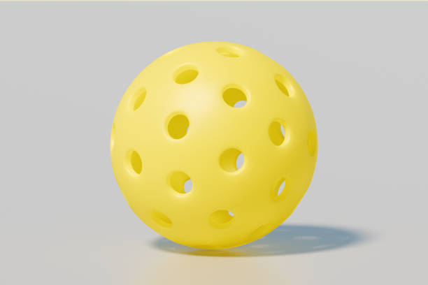 istock A yellow sport ball pickleball a neutral background. 3d rendering 2206084369