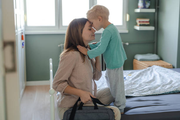 istock Mother saying goodbye to her child before leaving for work 2206086907