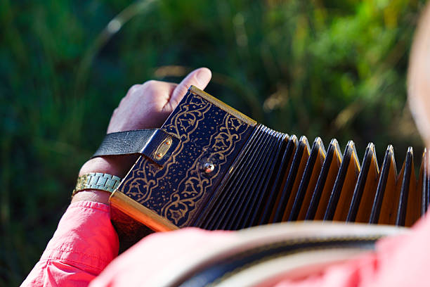 istock A Musician Skillfully Playing the Accordion While Surrounded by Beautiful Nature Scenes 2206087602
