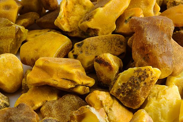 istock Unprocessed Polish Baltic amber on a clean white surface, showcasing its natural charm for jewelry creation. 2206088704