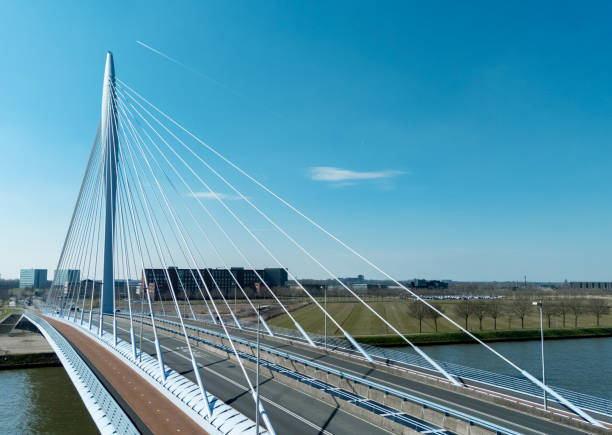 istock Dutch motorway bridge on a blue sky day 2206089412