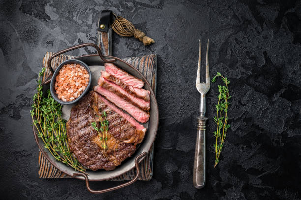 istock Grilled Rib eye prime steak, roasterd dry aged beef meat. black background. top view 2206095232