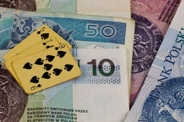 Some Polish Zloty banknotes and playing cards. This theme can represent a wide range of gaming and financial themes.
