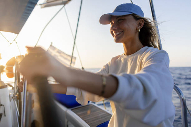 istock Woman skipper on a sailboat 2206096993