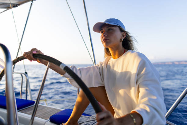 istock Woman skipper on a sailboat 2206096996