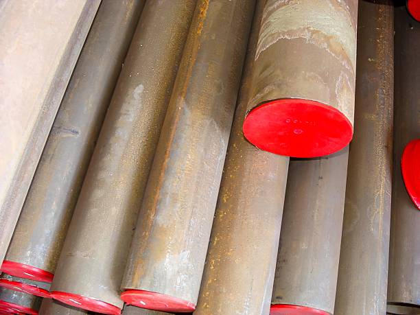 istock Pile of metal cylinder rods with red caps, ready for industrial use and engineering projects. 2206099613