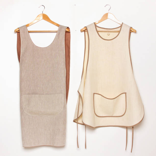 istock Kitchen linen eco-friendly women aprons on wooden hanger. Front view. 2206099953