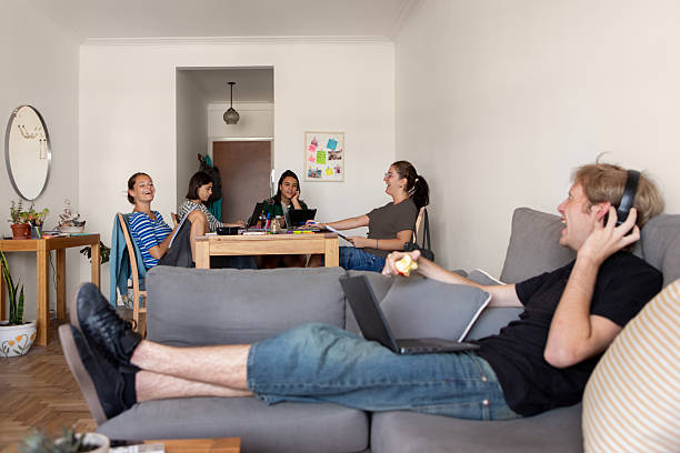 istock Latin American roommates studying in their student housing 2206101542