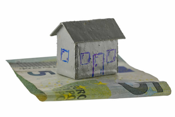 istock Small detached house model and European Union banknote 2206101677