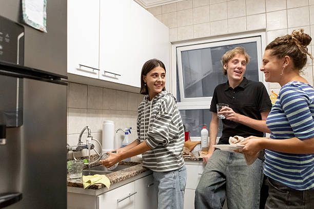 istock Latin American roommates preparing for dinner 2206102201