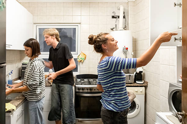 istock Latin American roommates preparing for dinner 2206102251