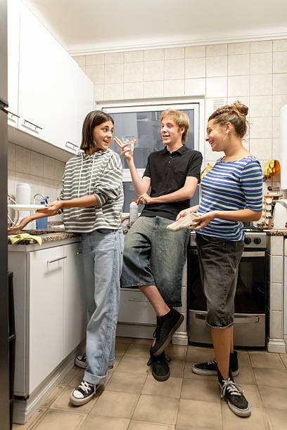 istock Latin American roommates preparing for dinner 2206102276