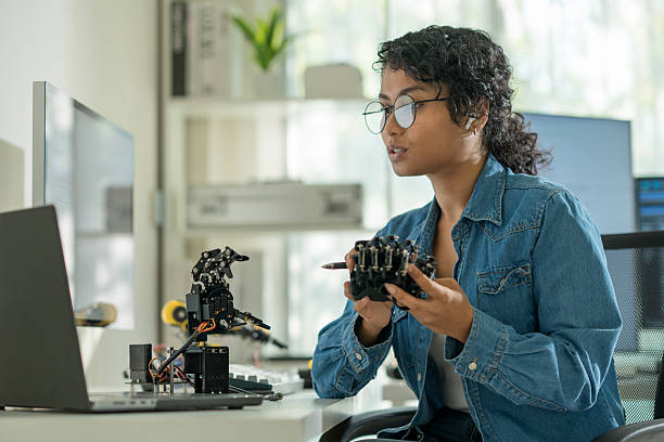 istock Southeast Asian women concentrating and analyzing AI data, demonstrating confidence and intelligence. 2206104913