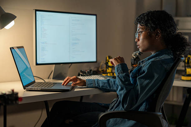 Deep Tech Professional: Developing AI and Machine Learning Solutions. Deep tech professional developing AI and machine learning solutions, working remotely with expertise in cyber security. woman studying night stock pictures, royalty-free photos & images
