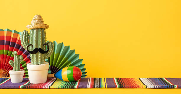 istock Colorful composition featuring a cactus in a sombrero and maraca, representing Mexican culture 2206106727