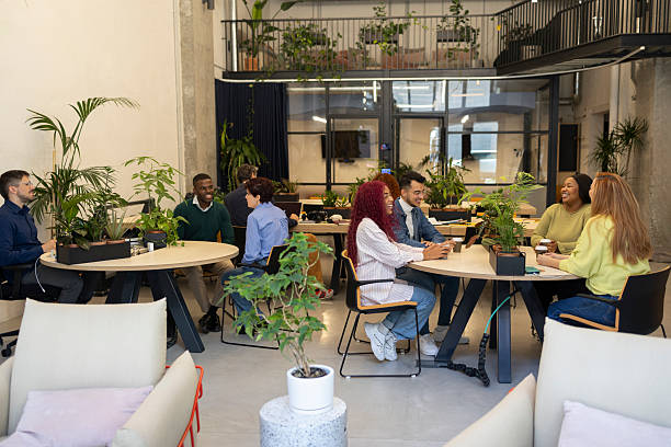 istock Diverse business team collaborating in modern green office space 2206109420
