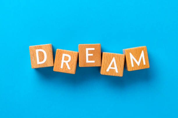 istock Block Words with Dream on a Blue Background 2206112552