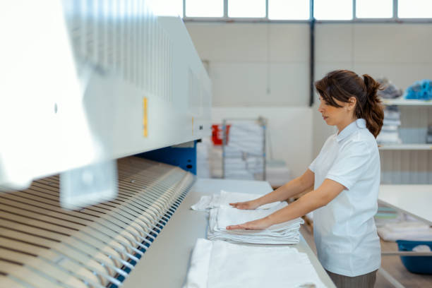 istock Dedicated Laundromat Owner Managing Daily Tasks 2206114170