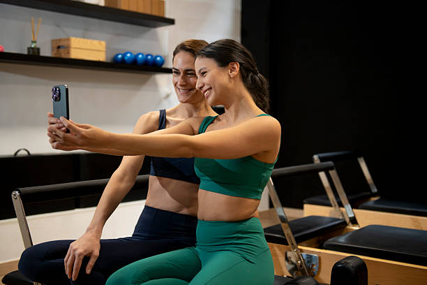istock Pilates instructors taking selfie after workout session in gym 2206119548