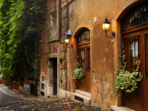 istock Cute street with cobblestone in Rome 2206120200