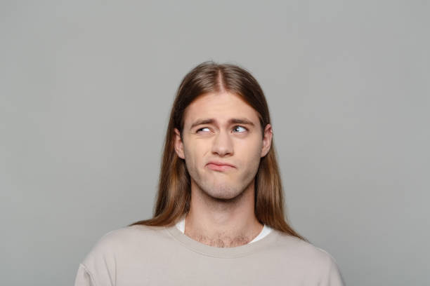 istock Headshot of thoughtful young man 2206126128