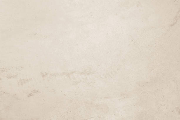istock Colour old concrete wall texture background. Close up retro plain cream color cement wall background texture. Design paper vintage parchment element. 2206127424