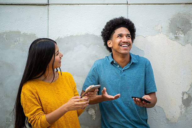 boyfriend and girlfriend with mobile phones