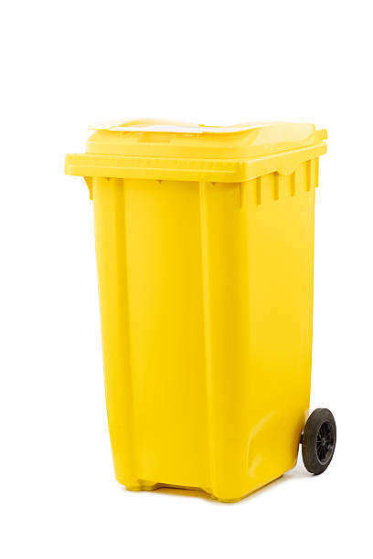 istock Bright Yellow Plastic Trash Bin with Wheels: A Convenient Solution for Waste Management and Recycling at Home or Office, Ideal for Daily Use in Cleanliness and Organization 2206129417