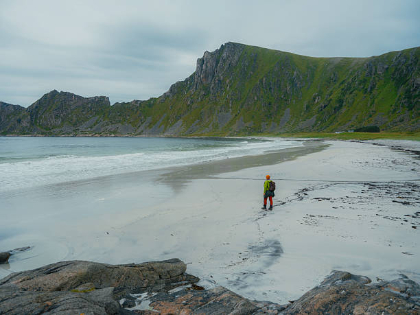 istock Man hiking on the beach in Norway 2206130904