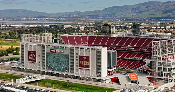 Drone shot of Levi's Stadium, home of the San Francisco 49ers NFL team, on a sunny spring morning in Santa Clara, California. \n\nAuthorization was obtained from the FAA for this operation in restricted airspace.