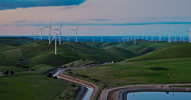 istock Aqueduct Tributary Flowing Towards Altamont Pass Windmills 2206136562