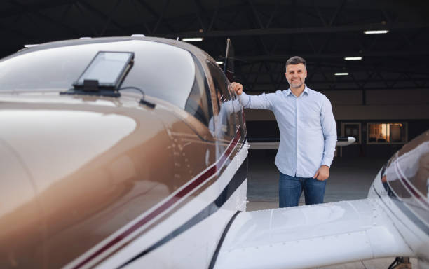 istock Businessman posing by the private jet 2206138411