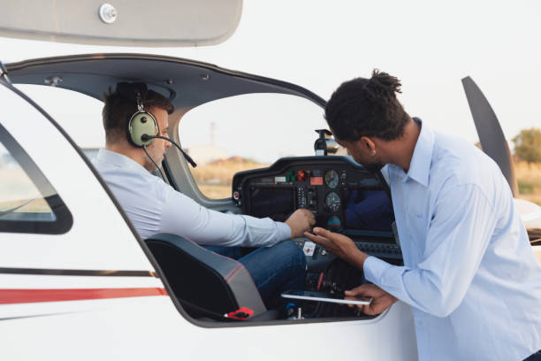 istock Pilot along with the co-pilot is preparing the plane for departure 2206138421