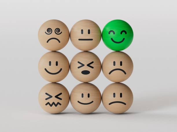istock Creative idea and smart people, unique, difference, leadership, solutions and motivation concepts. Happy smile face BALL on wooden BALL block stack with other dumb faces on white background. 2206141366