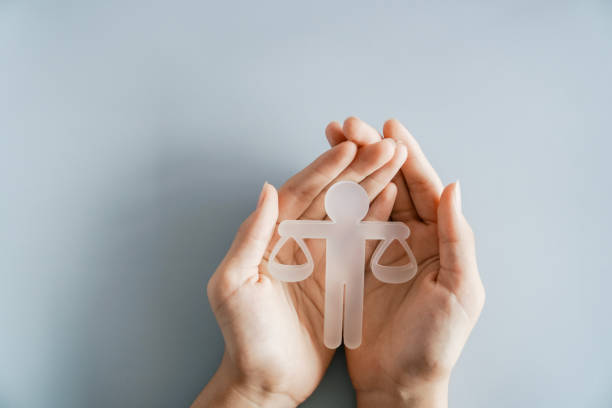 Hand holding Ethical model, business ethics and corporate compliance concept