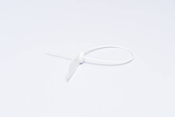 White plastic seal on white background. Plastic seal for sealing valuable goods and parcels. Logistics concept.