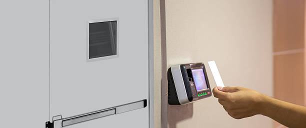 istock Proximity card reader door unlock, Close up hand of security man using ID card scanning at the access control system for identity verification to open the door exit or fire escape or check attendance. 2206158196