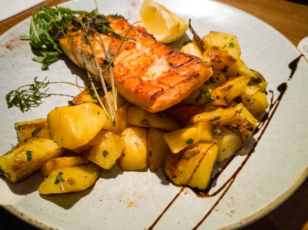 istock grilled salmon with fried potatoes 2206160938