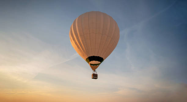 istock Hot air balloon in clear sky at dawn 2206162966