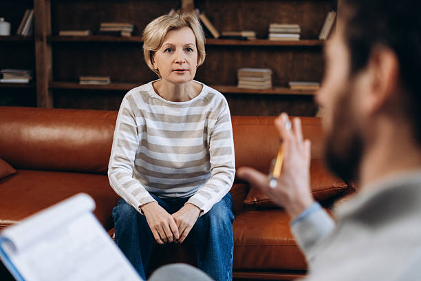 istock Upset woman is developing mindfulness and psychological health during therapy session 2206169374